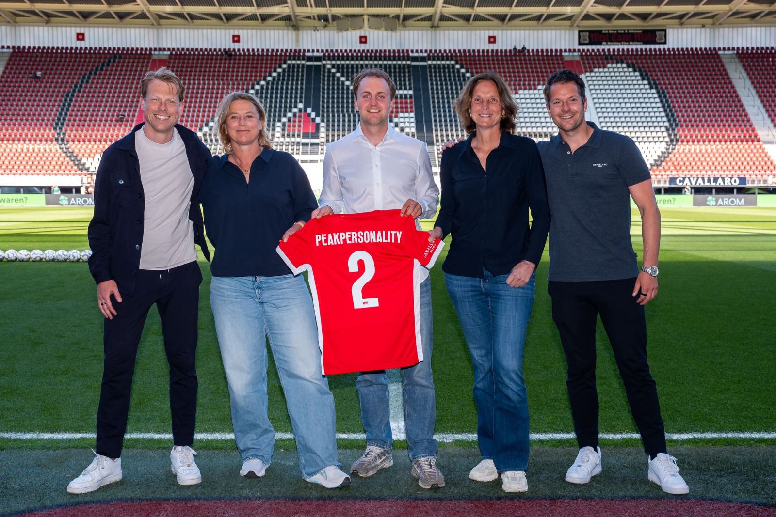 AZ Alkmaar stadium pitch view with a graphic announcing the PeakPersonality partnership.